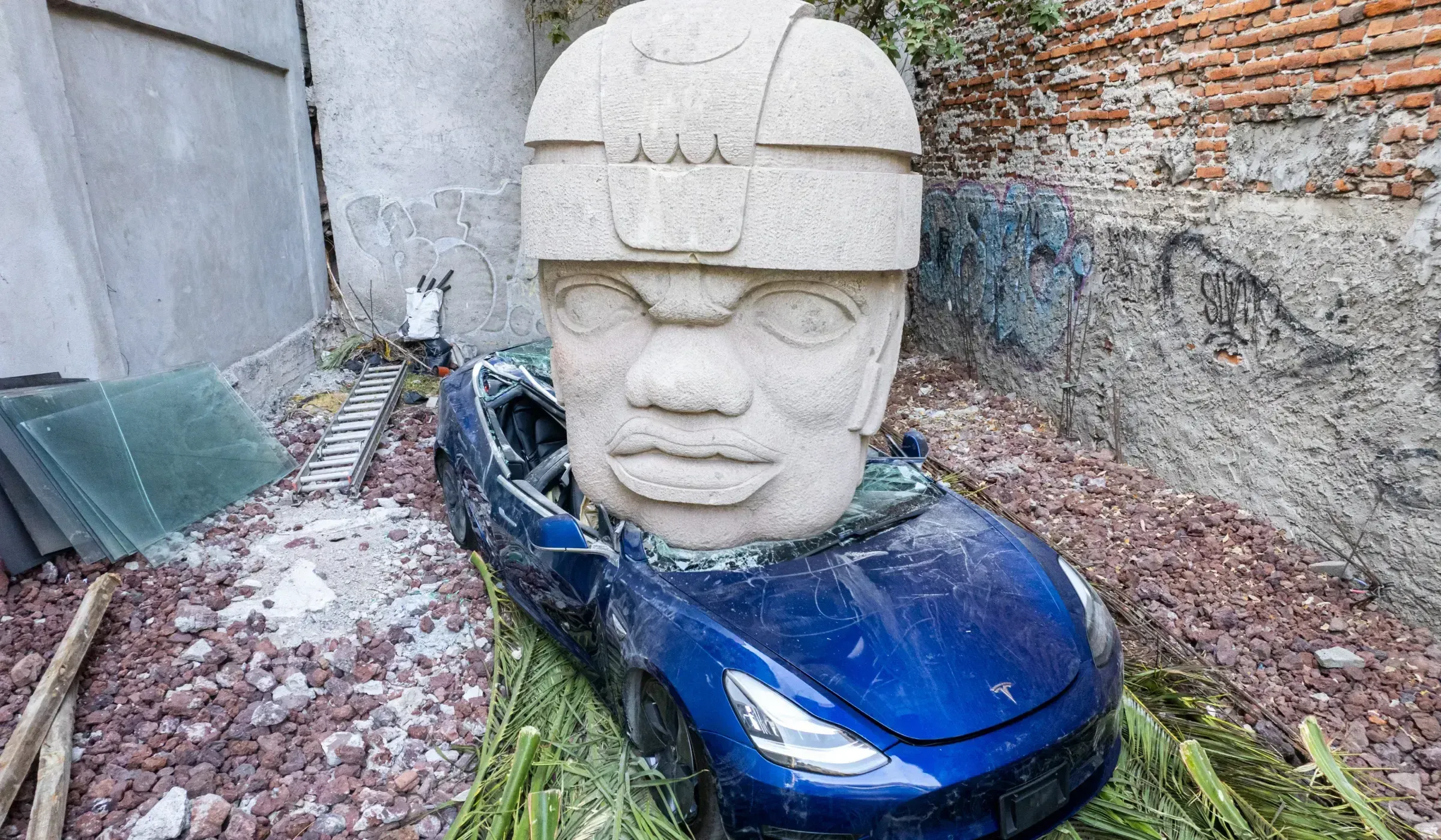 Tesla Crushed by an Olmec Head